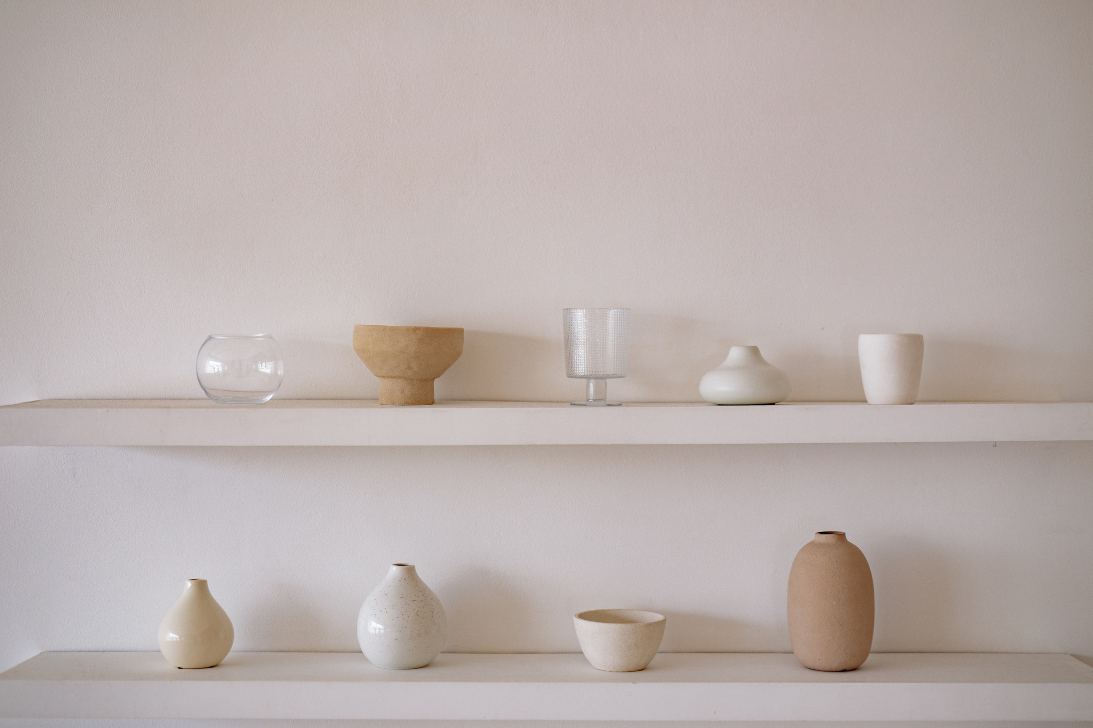 White Ceramic Bowls on White Wooden Shelf